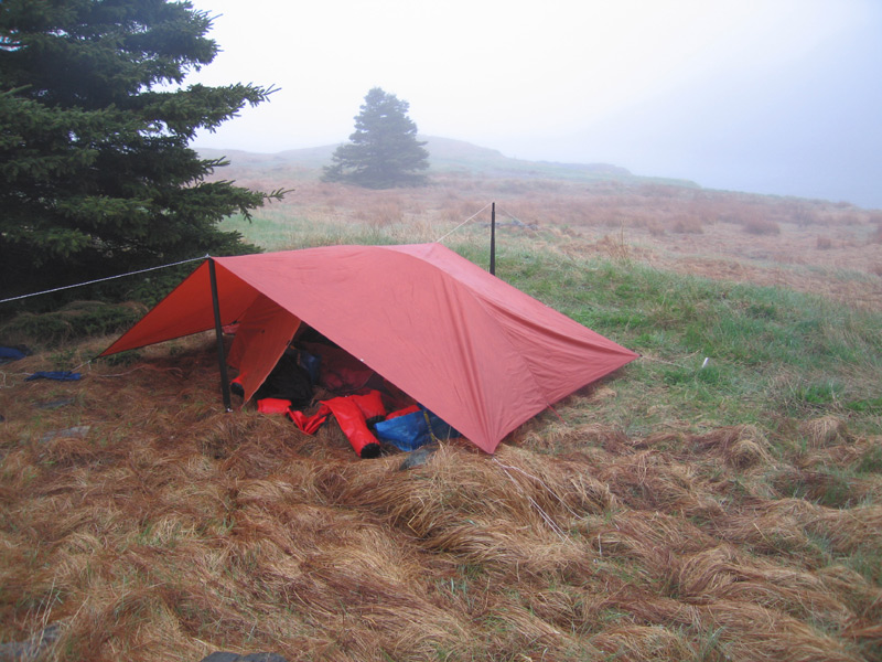 Wet camp. We rig up the tarp.