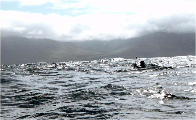 Disappearing amongst the waves. Blacks seas and a black kayak…